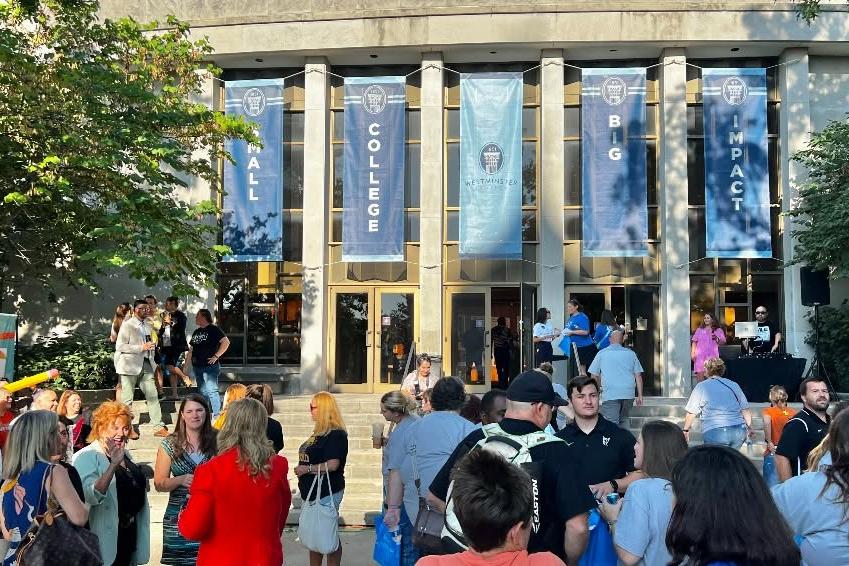 Educators gather in front of Champ Auditorium on a sunny day during the 2025 Teachers' Appreciation Breakfast.